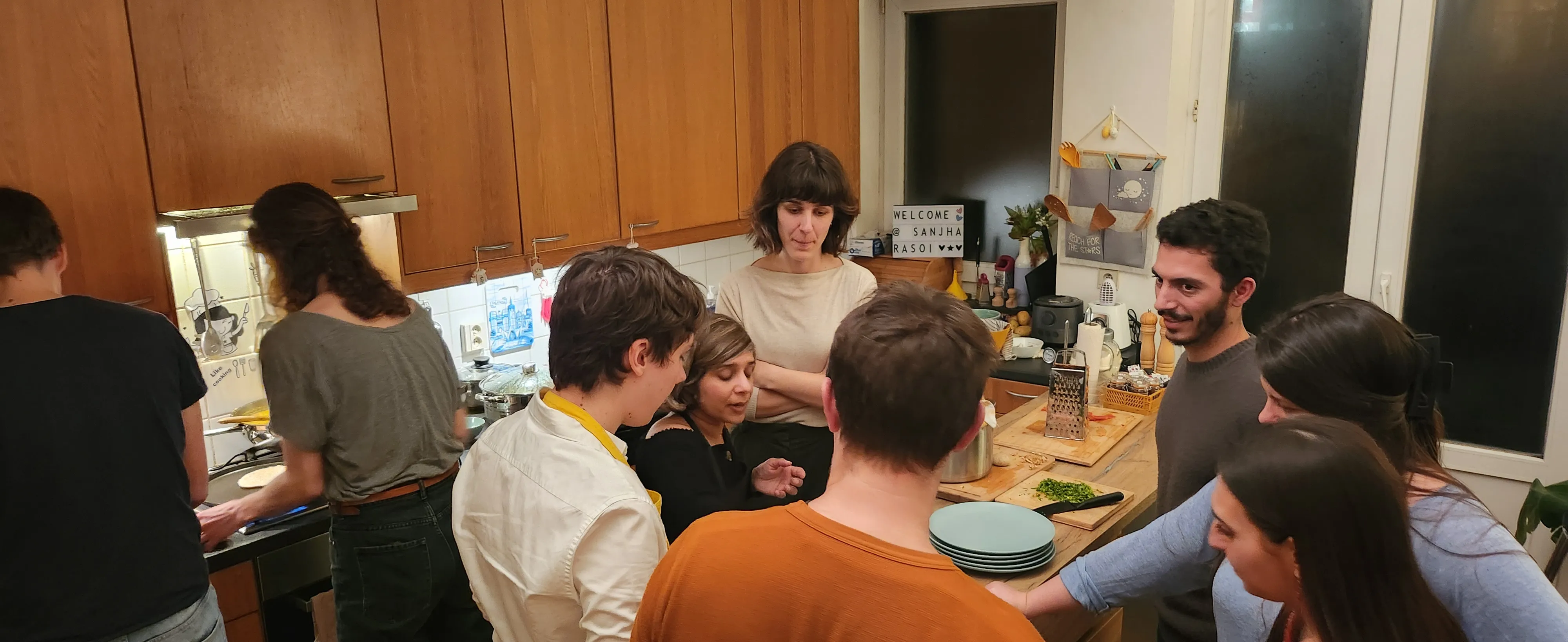 Small group activity around a shared cooking task.