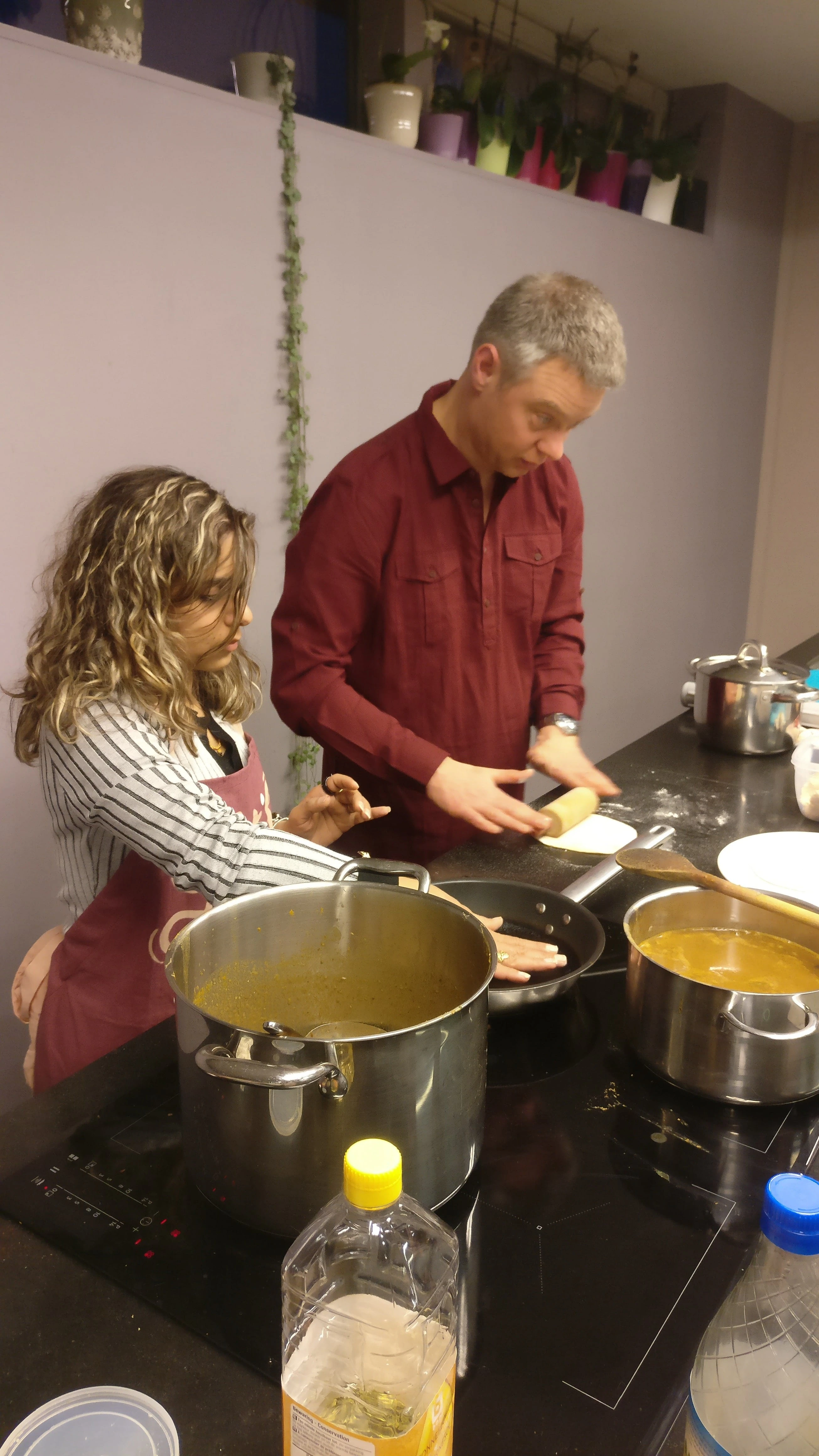 A participant concentrating on the cooking process.